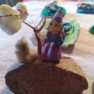 Ghome on garnett stone under a desert crystal tree. Hand made